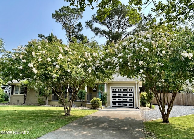2409 Westminister Way, Wilmington, NC 28405 - view of property hidden behind natural elements featuring an attached garage and driveway