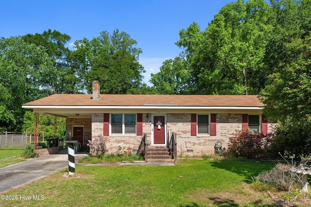 view of front facade with fence, brick siding, crawl space, a front yard, and a chimney