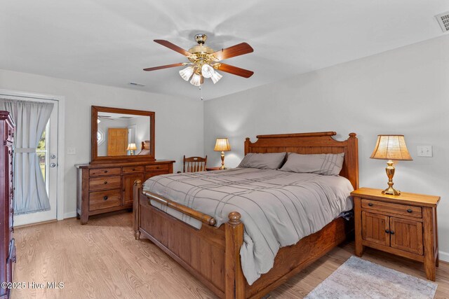 bedroom featuring light wood-type flooring, visible vents, ceiling fan, and access to exterior