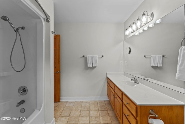 full bathroom with shower / bathing tub combination, baseboards, and vanity