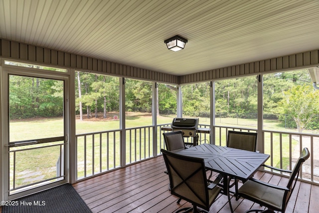 sunroom with outdoor dining space