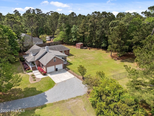 bird's eye view featuring a forest view