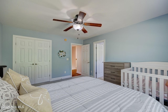 bedroom featuring a closet, baseboards, and ceiling fan