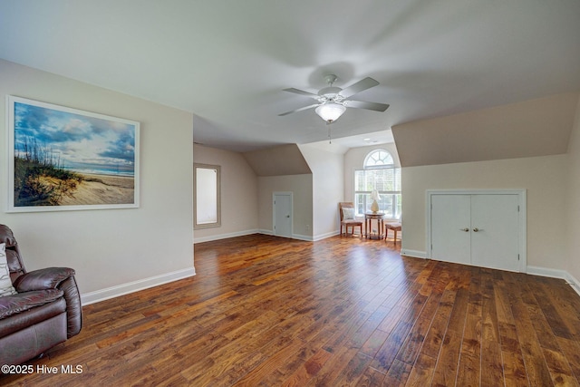 bonus room with baseboards, ceiling fan, wood finished floors, and vaulted ceiling
