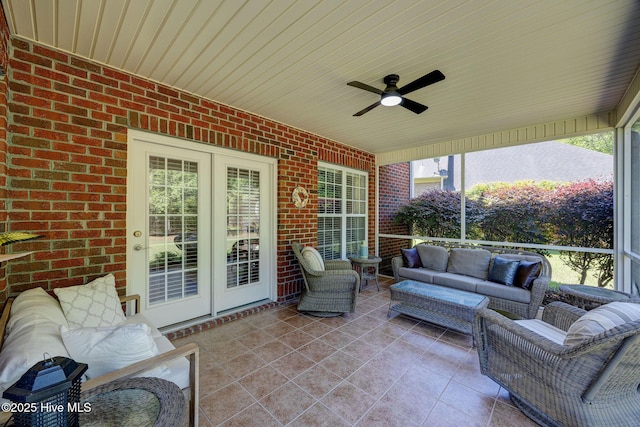 view of patio / terrace with french doors, an outdoor living space, and a ceiling fan