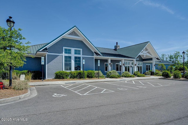 view of building exterior with uncovered parking