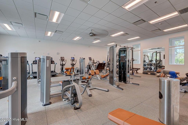 workout area featuring visible vents and a drop ceiling