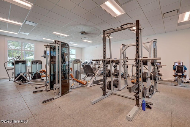 exercise room featuring a drop ceiling
