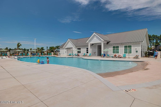 pool with fence and a patio area