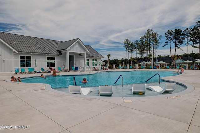 pool featuring a patio area and fence