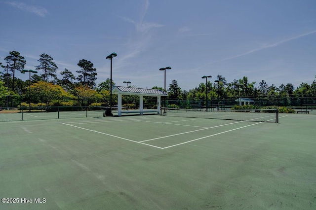 view of sport court featuring community basketball court and fence