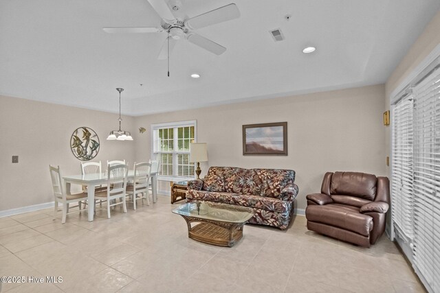 908 Resort Cir Unit 701, Sunset Beach, NC 28468 - living room with visible vents, baseboards, recessed lighting, a ceiling fan, and light tile patterned floors