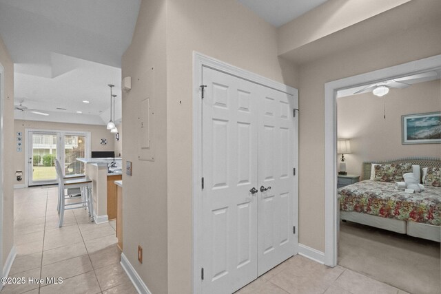 908 Resort Cir Unit 701, Sunset Beach, NC 28468 - hallway featuring baseboards, recessed lighting, and light tile patterned floors