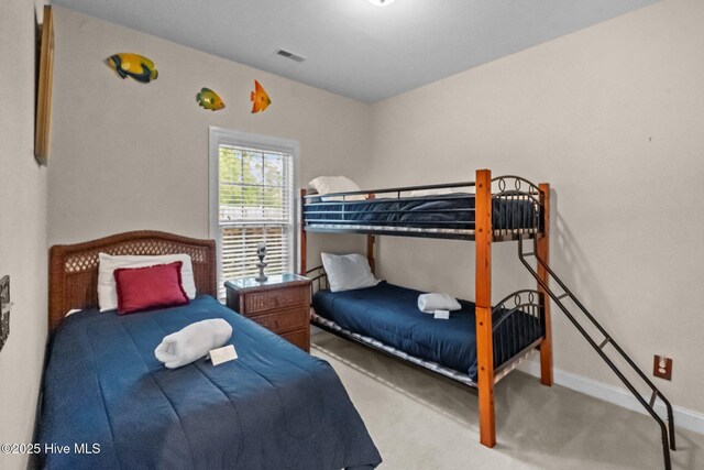 908 Resort Cir Unit 701, Sunset Beach, NC 28468 - carpeted bedroom with baseboards and visible vents