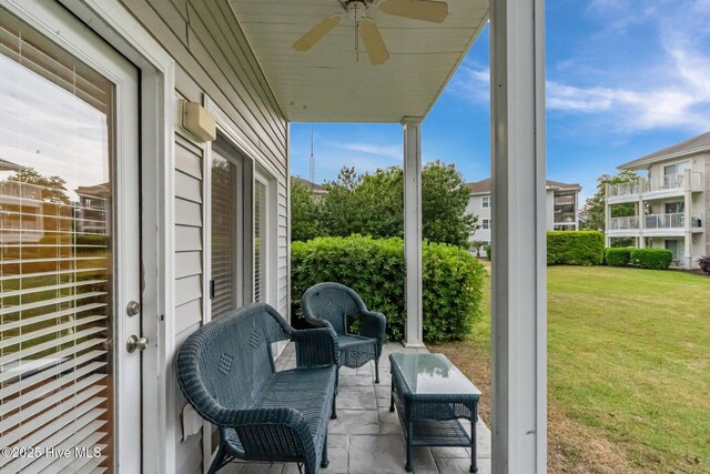 908 Resort Cir Unit 701, Sunset Beach, NC 28468 - view of patio / terrace with a ceiling fan