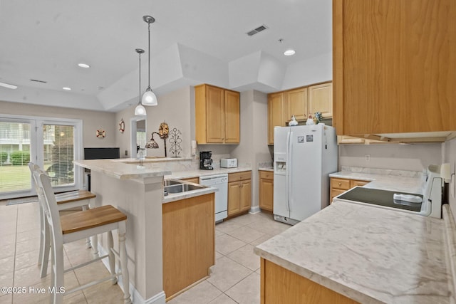 908 Resort Cir Unit 701, Sunset Beach, NC 28468 - kitchen featuring a peninsula, visible vents, white appliances, light brown cabinets, and light tile patterned floors