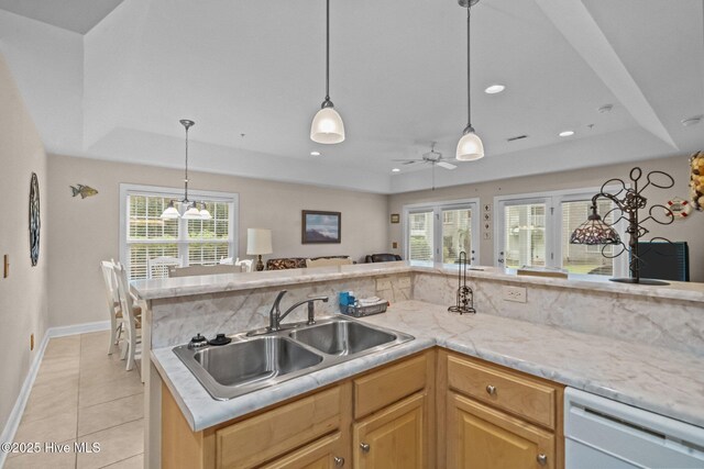 908 Resort Cir Unit 701, Sunset Beach, NC 28468 - kitchen with a sink, open floor plan, light tile patterned floors, dishwasher, and a tray ceiling