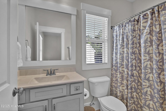 bathroom with vanity, toilet, and a shower with curtain