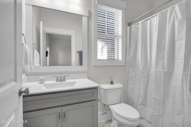 bathroom with vanity, toilet, and a shower with curtain