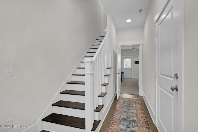 staircase with recessed lighting, baseboards, ceiling fan, and visible vents