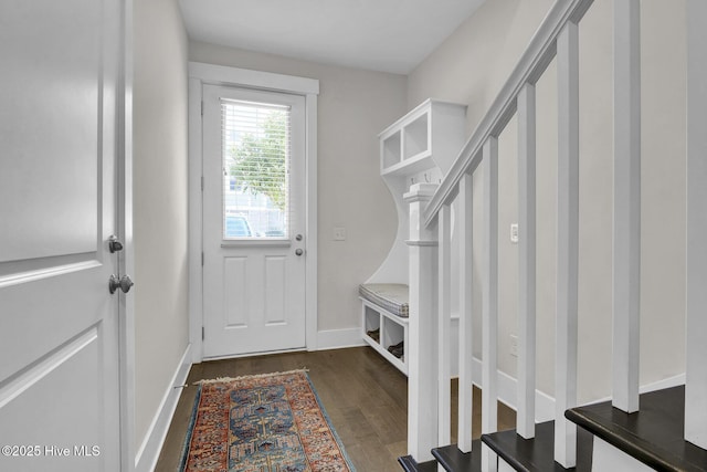 mudroom featuring baseboards and wood finished floors