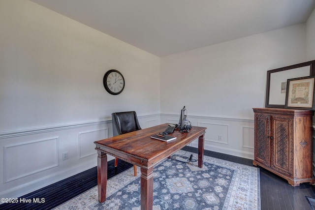 7240 Orchard Trce, Wilmington, NC 28409 - home office with wood finished floors, a wainscoted wall, and a decorative wall
