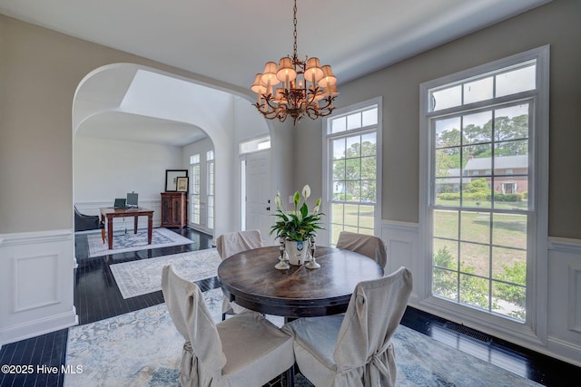 7240 Orchard Trce, Wilmington, NC 28409 - dining room with a decorative wall, a healthy amount of sunlight, and a wainscoted wall