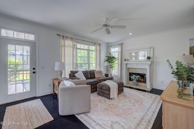 7240 Orchard Trce, Wilmington, NC 28409 - living area with crown molding, ceiling fan, a fireplace with flush hearth, and baseboards