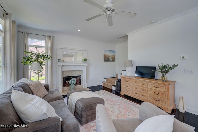 7240 Orchard Trce, Wilmington, NC 28409 - living area featuring a fireplace, ceiling fan, crown molding, baseboards, and wood finished floors