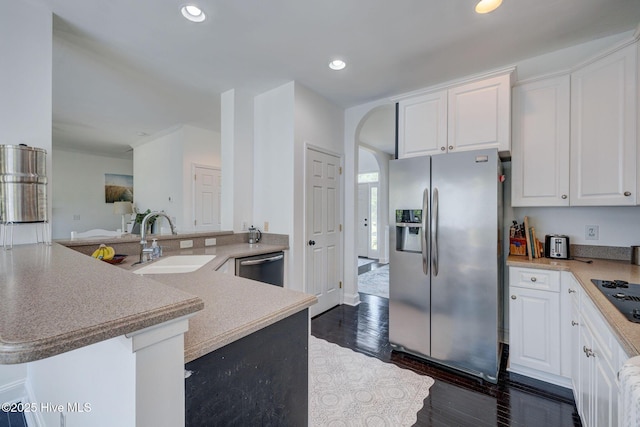 7240 Orchard Trce, Wilmington, NC 28409 - kitchen with appliances with stainless steel finishes, white cabinets, arched walkways, and a sink