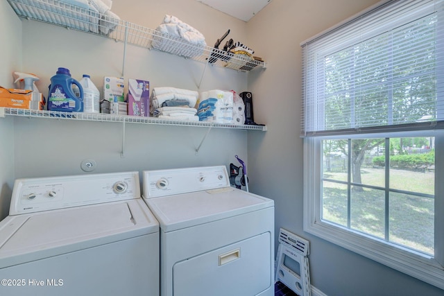 7240 Orchard Trce, Wilmington, NC 28409 - washroom featuring a healthy amount of sunlight, baseboards, laundry area, and washing machine and dryer