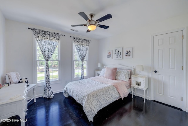 7240 Orchard Trce, Wilmington, NC 28409 - bedroom featuring dark wood-type flooring, visible vents, ceiling fan, and baseboards