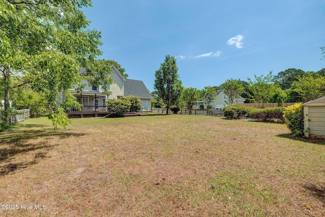 7240 Orchard Trce, Wilmington, NC 28409 - view of yard featuring a wooden deck and a fenced backyard