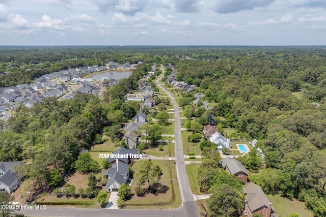 7240 Orchard Trce, Wilmington, NC 28409 - drone / aerial view with a residential view and a wooded view