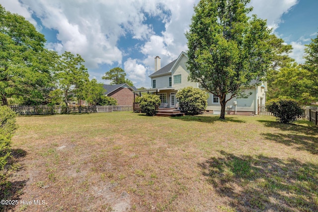 7240 Orchard Trce, Wilmington, NC 28409 - view of yard featuring a deck and a fenced backyard
