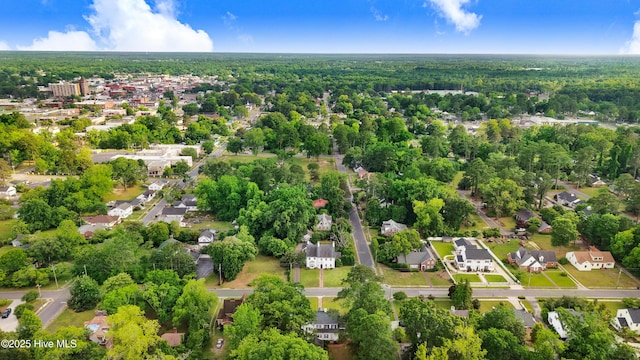 aerial view with a wooded view and a residential view
