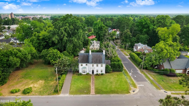 drone / aerial view featuring a wooded view