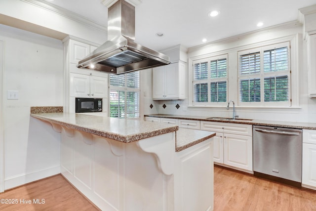 kitchen featuring a sink, island exhaust hood, light wood finished floors, black microwave, and stainless steel dishwasher
