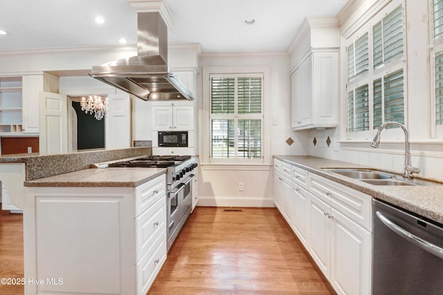 kitchen with light wood finished floors, stainless steel appliances, a sink, and island exhaust hood