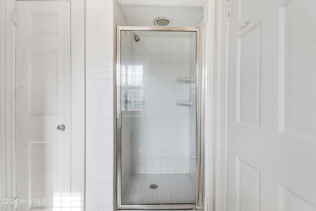 full bathroom with a shower stall
