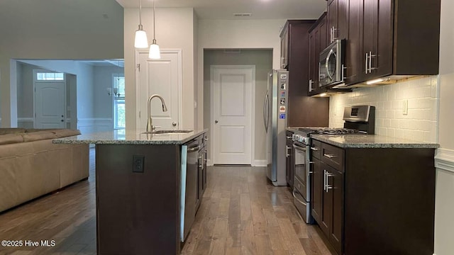 112 Schever Rd, West End, NC 27376 - kitchen featuring appliances with stainless steel finishes, a sink, dark brown cabinets, and wood finished floors