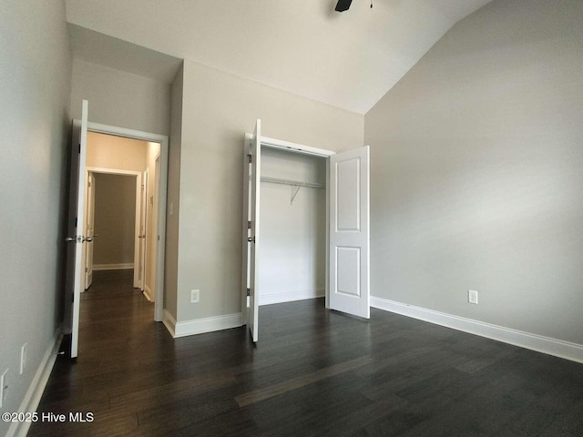 112 Schever Rd, West End, NC 27376 - unfurnished bedroom featuring lofted ceiling, dark wood finished floors, a closet, and baseboards