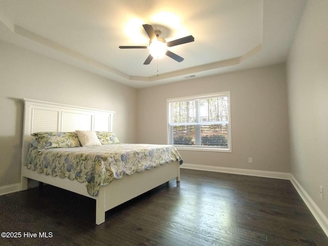 112 Schever Rd, West End, NC 27376 - bedroom featuring a raised ceiling, dark wood finished floors, baseboards, and ceiling fan