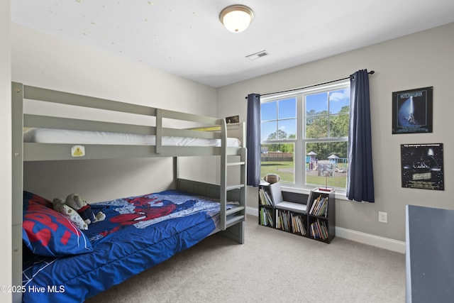 carpeted bedroom with baseboards and visible vents