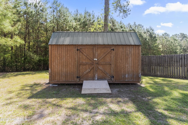 view of shed with fence