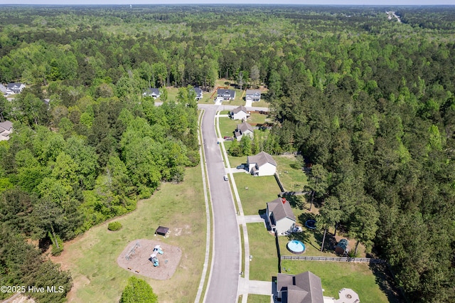 bird's eye view featuring a view of trees