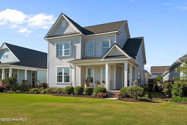 view of front of home with a porch and a front yard