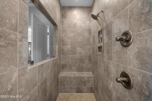 full bath featuring a tile shower
