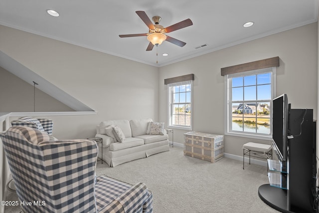 living room with ceiling fan, carpet, baseboards, recessed lighting, and ornamental molding