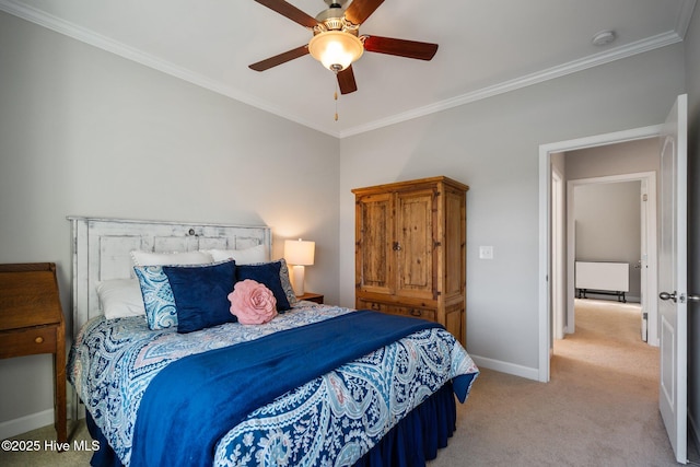 bedroom with light colored carpet, baseboards, ornamental molding, and ceiling fan